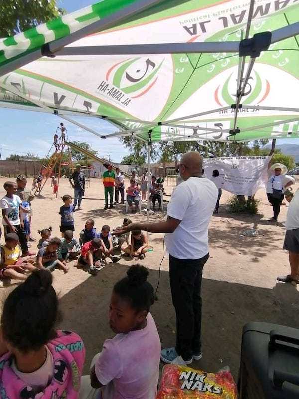Warrant Officer Wilfred Thomas delivering a talk to young children